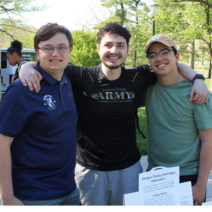 Three male students pose together at Galvin Scholars Year-End Event