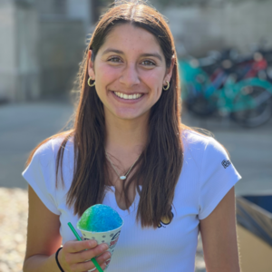 A student holds snow cone and smiles at Galvin Scholars Year-End Event