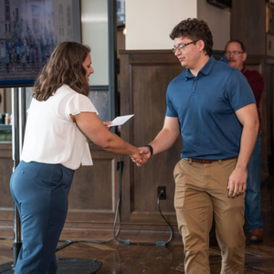 2024 Galvin Scholars Senior Brunch Professor Kelley shaking students hand